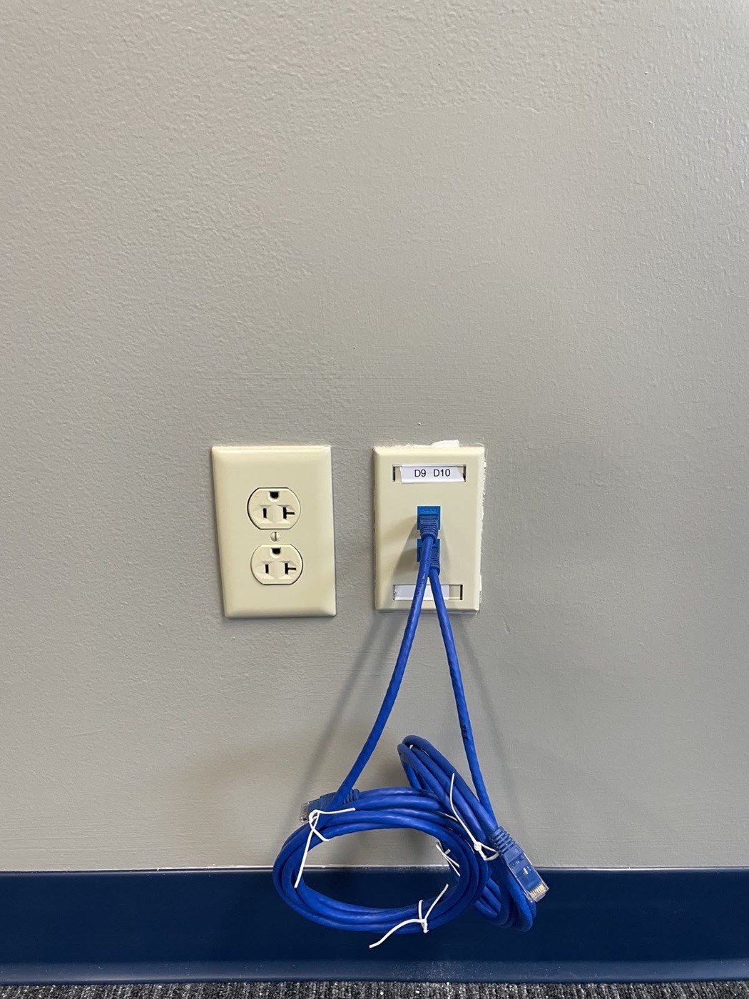 Workstation drop mid-termination at the faceplate with a dressed service loop